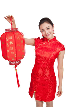 棚拍身穿中国传统服装的年轻女人提红灯笼