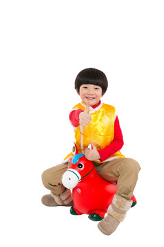 棚拍节日气氛中的唐装儿童拿糖葫芦骑小马