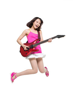 棚拍时尚女青年边弹吉他边跳舞