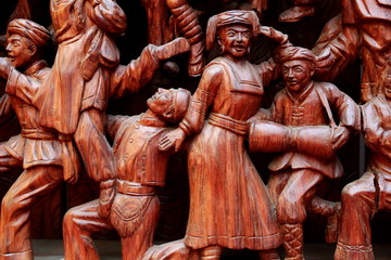 红木雕刻少数民族载歌载舞图案