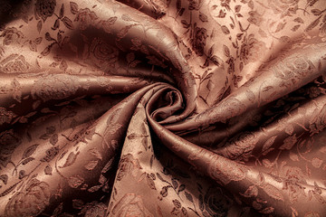 褐色暗花绸缎质地化纤窗帘布背景
