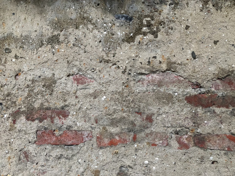 水泥抹灰下的红砖墙