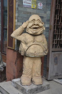 泥塑迎客
