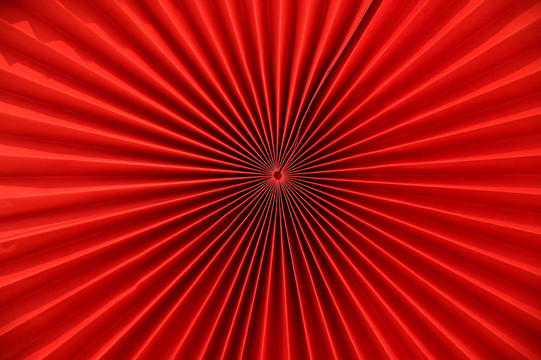 红色放射状折纸纹理背景