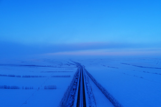 航拍雪域雪原公路暮色