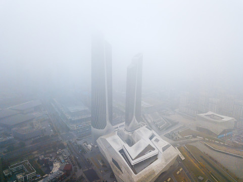 航拍雾中的南京双子塔