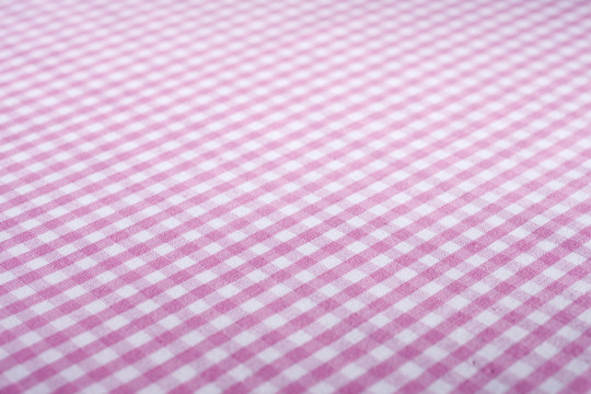 粉红色格子布的库存图像。