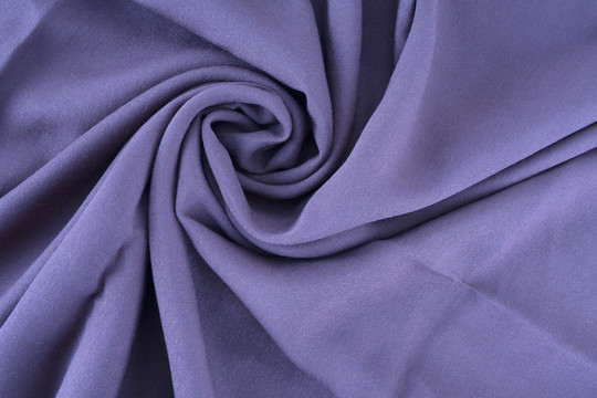 旋转褶皱的针织棉布料背景