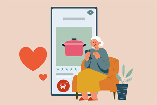 使用手机在线购买厨具的老年妇女