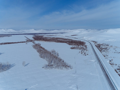航拍冬季雪原公路