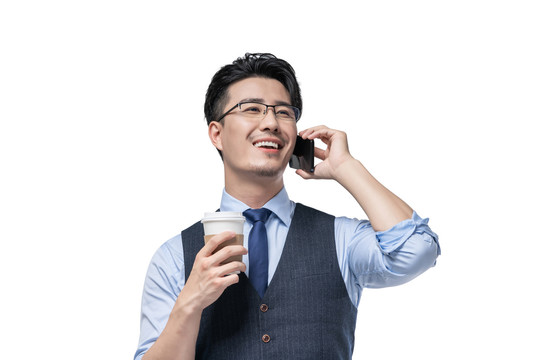 商务男士拿着咖啡使用手机