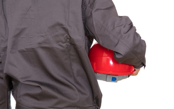 建筑工人手里的红色安全帽