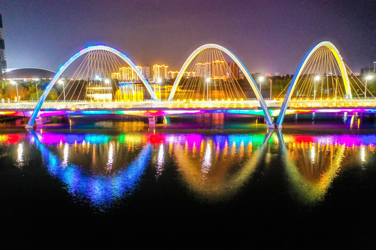 航拍新郑创业路跨轩辕湖桥夜景
