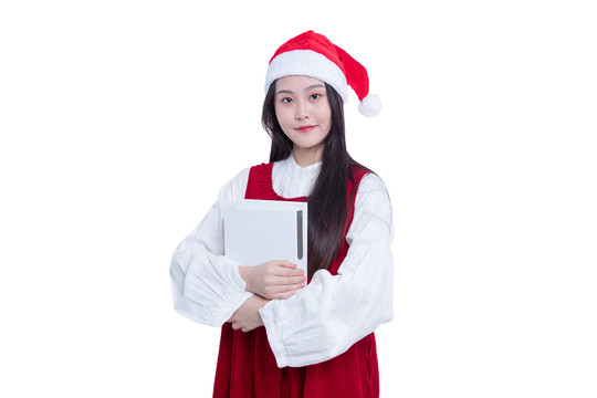 圣诞帽的女学生怀抱着书本