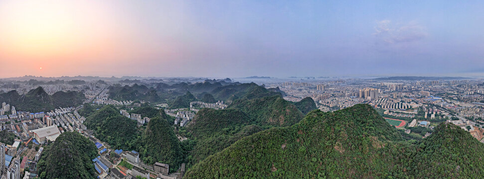 广西柳州城市清晨日出航拍全景图