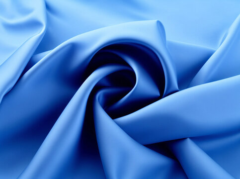 浅蓝色布料丝绸螺旋褶皱背景
