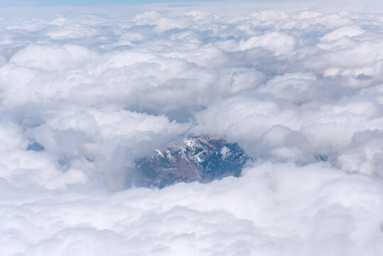 航拍中国新疆的蓝天白云雪山