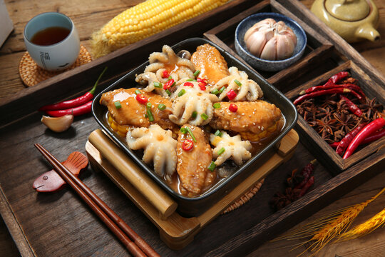 鸡中翅八爪鱼须煲美食菜品摄影图