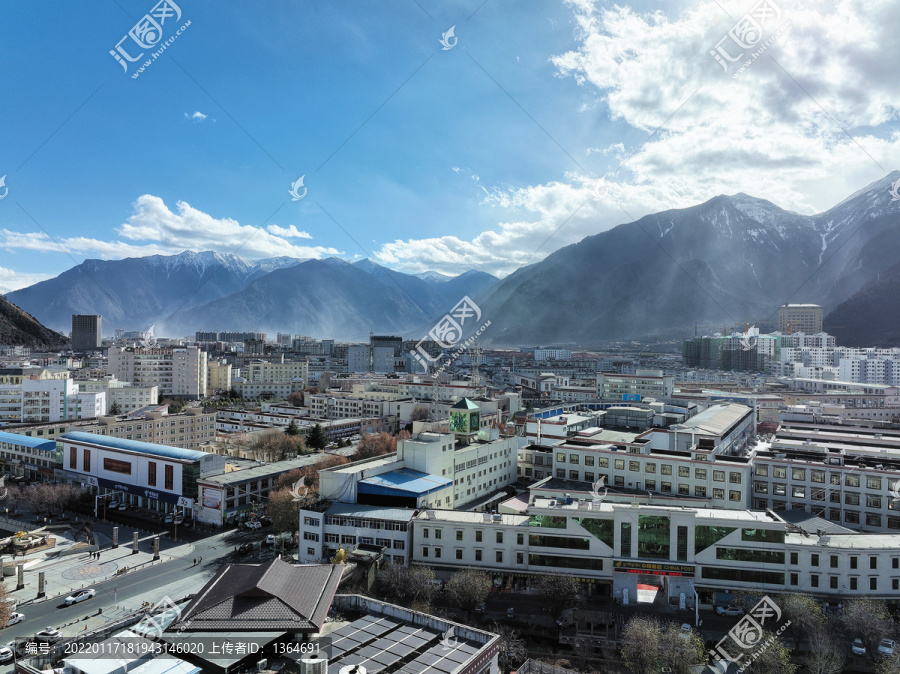 航拍西藏林芝市区冬季雪山